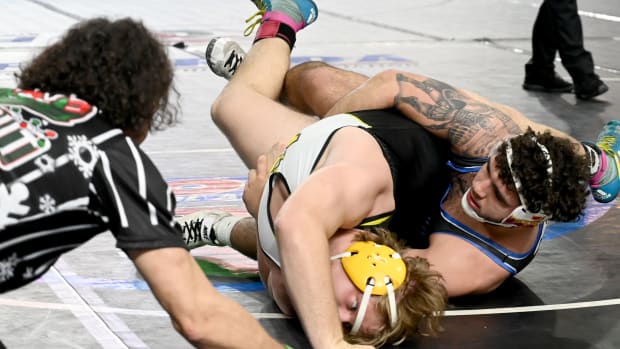 Sawyer Bartelt from South Dade works his way to a semifinals win against Kaleb Ivie from Merritt Island in a 215-pound match on Saturday at the Knockout Christmas Classic at Silver Spurs Arena in Kissimmee. 